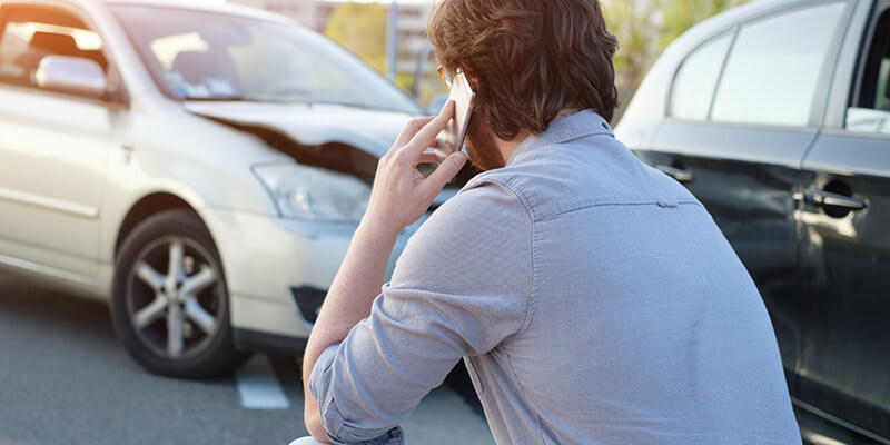 car accident man on phone