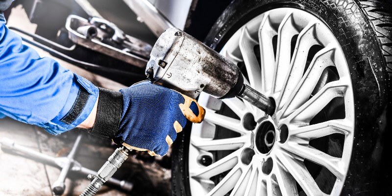 Mechanic Fitting A Tyre